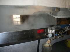 Steam rises from boiling pan